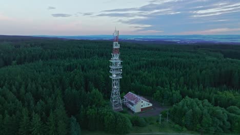 a radio receiver towering high above the forest