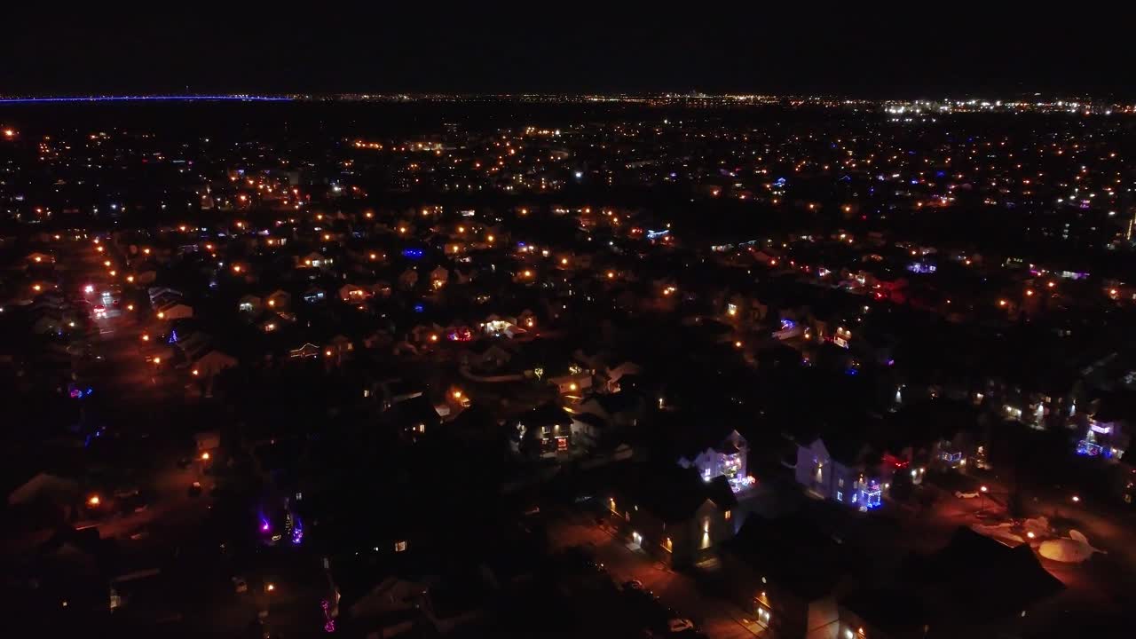 A view of a residential area in the city of Saint Constant at night covered in snow illuminated with street lights, Quebec , Canada