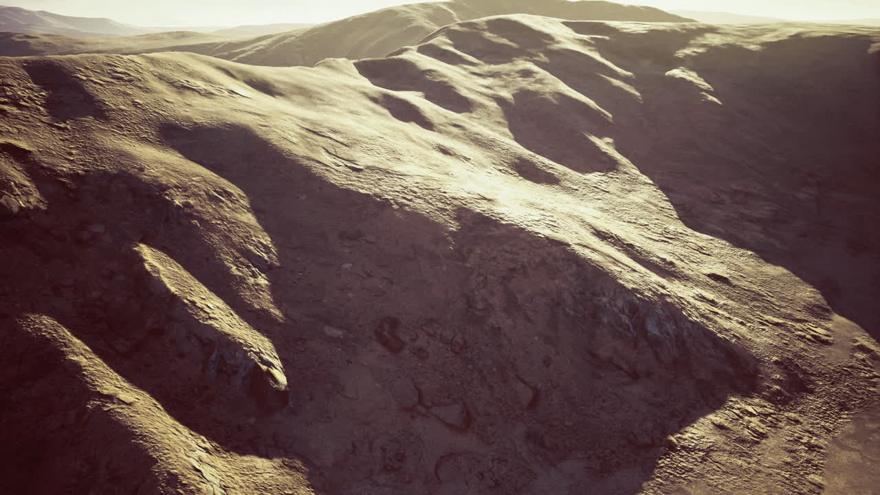 Unique geological formations showcase rugged terrain under sunlight