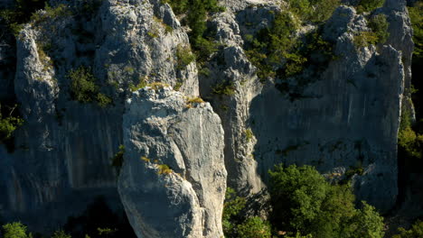 aerial view of vela draga limestone canyon with a rock climber in vranja, croatia