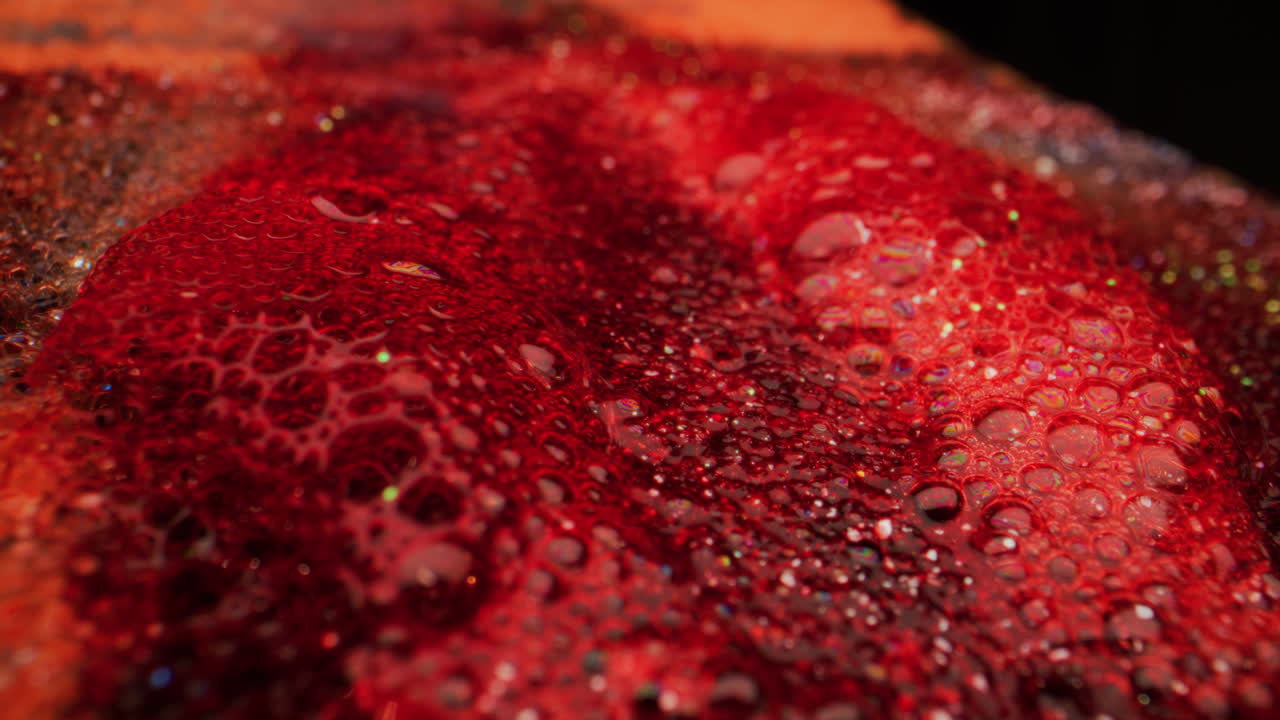 Red Liquid with Bubbles and Glitter