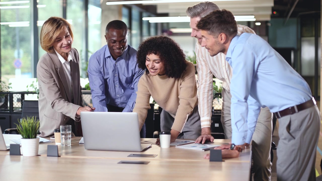Diverse Business Team Collaborating and Discussing in Modern Office