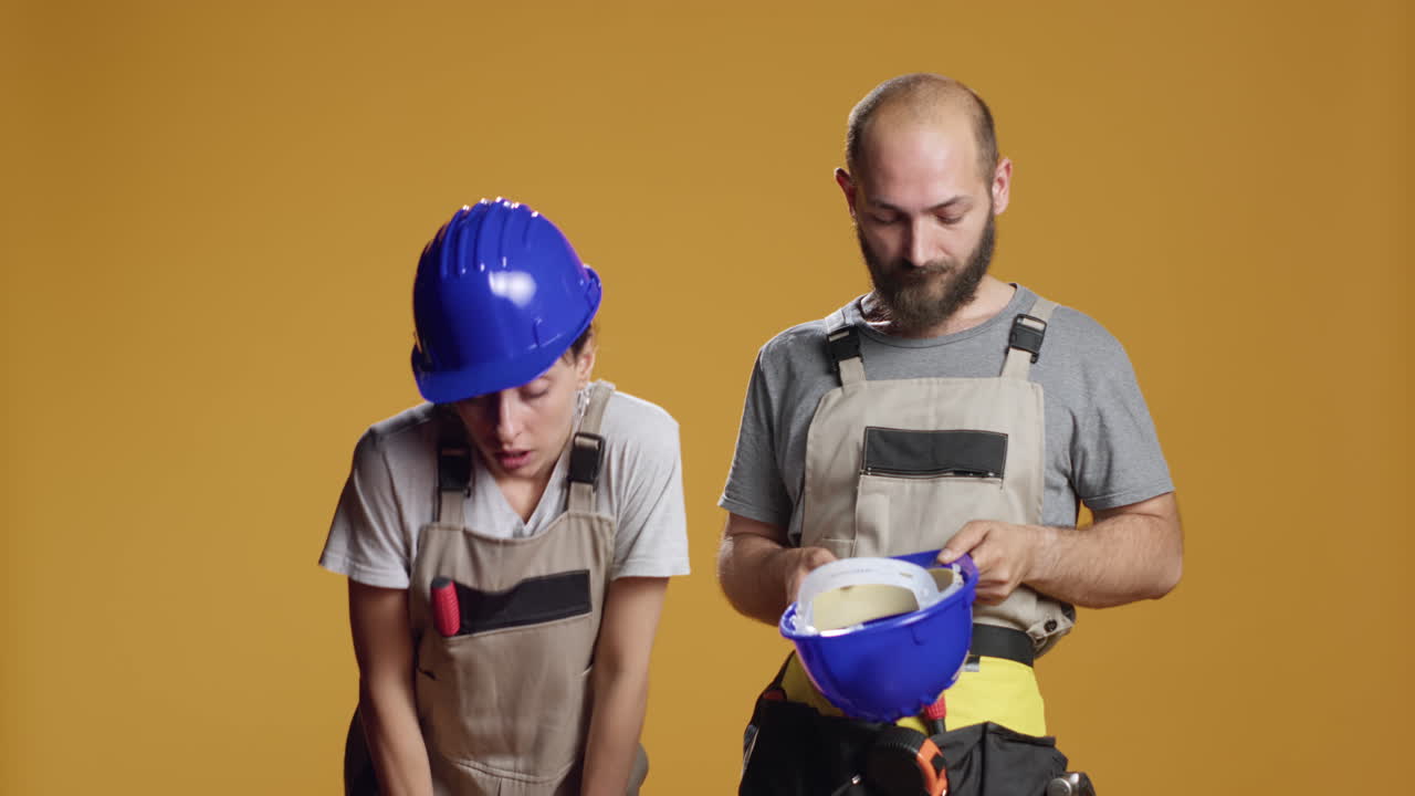 Team of tired construction workers feeling sleepy before repair work