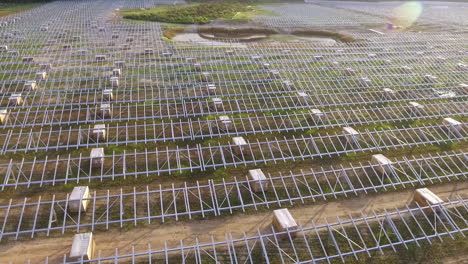 Drone-shot-of-a-solar-field-being-constructed,-revealing-aerial-shot