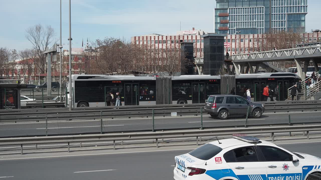 City Street Scene with Bus Station and Highway Traffic