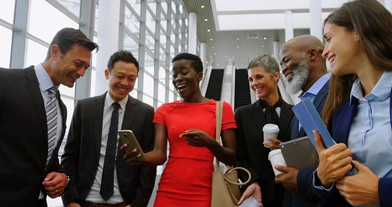 Red-dress woman holding phone, sharing, six staff leaning, marketing overlays animating around it