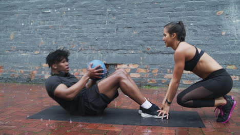 man and woman workout outdoors