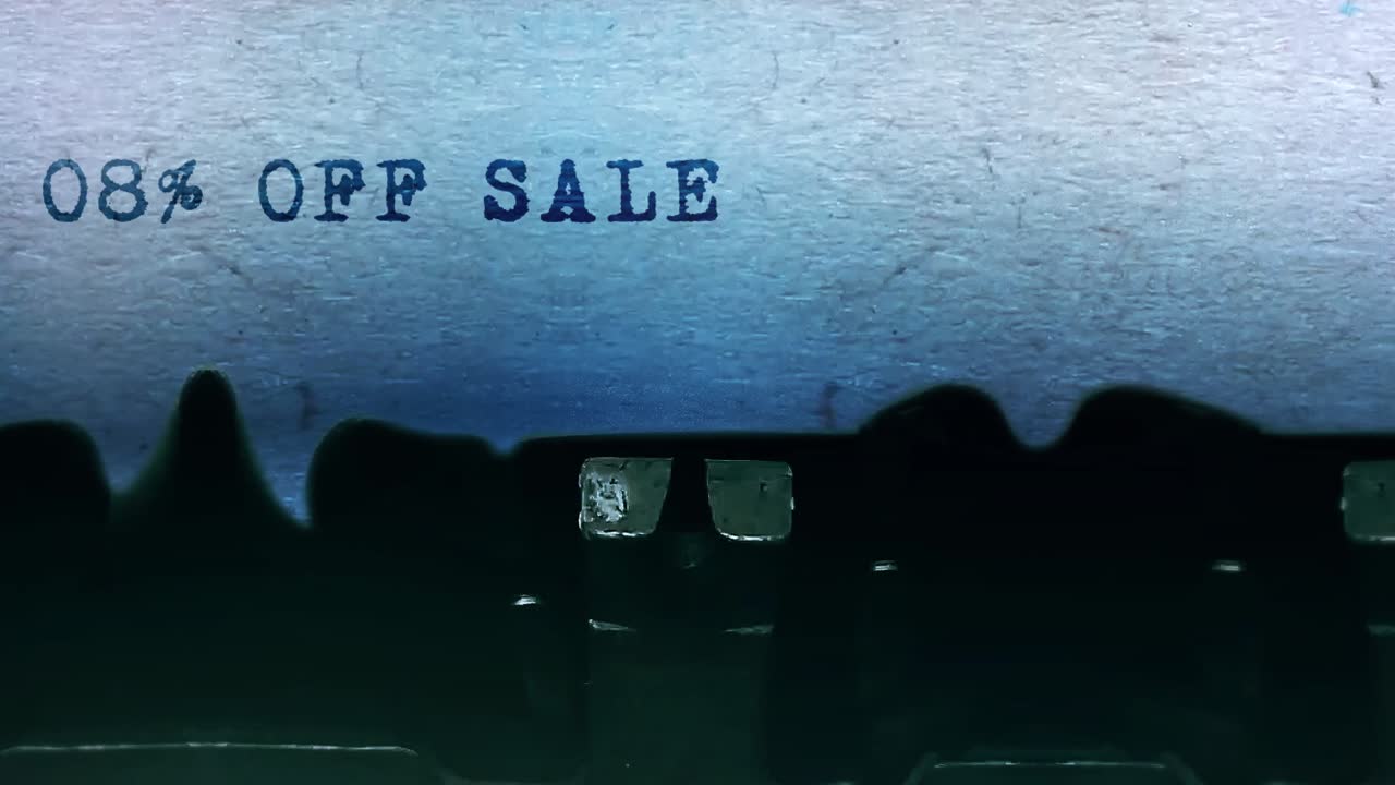 08 off sale word closeup being typing and centered on a sheet of paper on old vintage typewriter