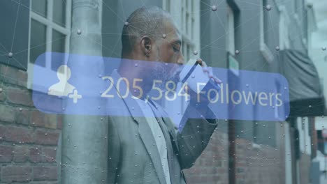 Animation-of-followers-text-with-number-and-network-of-connections-over-african-american-businessman