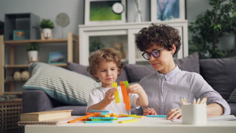 mother and child playing with building blocks