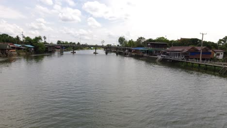 static shot: view from a pedestrian bridge over the mae klong river in thailand