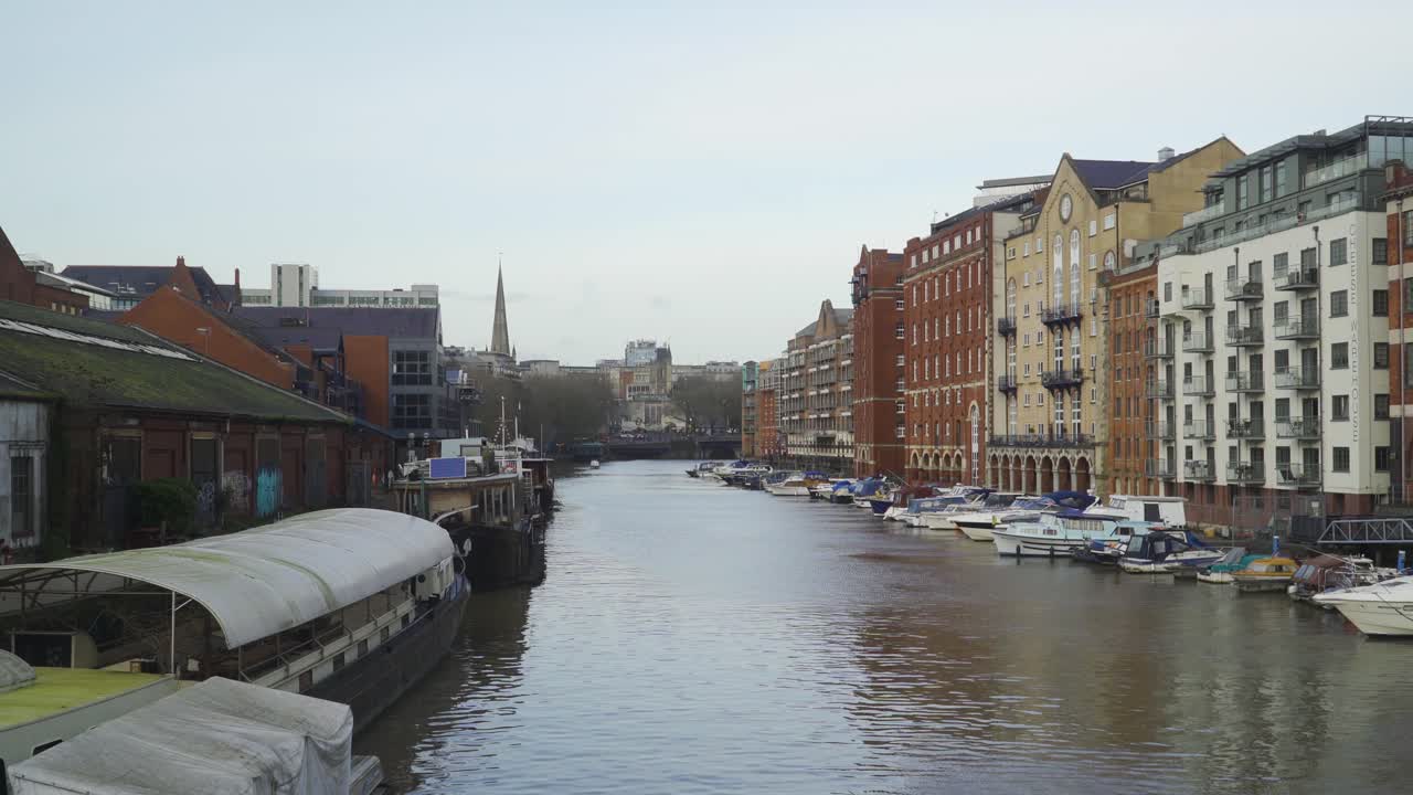 BRISTOL, SOMERSET, ENGLAND, December 23, 2019: Bristol city harbour. Avon river. Beautiful buildings on the right side of the harbour.