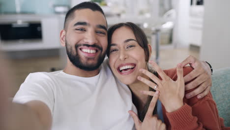 Portrait-of-young-excited-couple-sharing-news