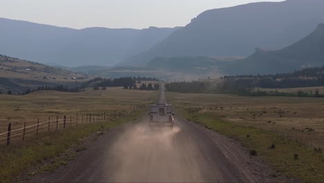 scenic drive on a gravel road through a mountain valley