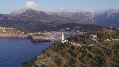 port sóller in the north coast of mallorca with mountain background low clouds, aerial