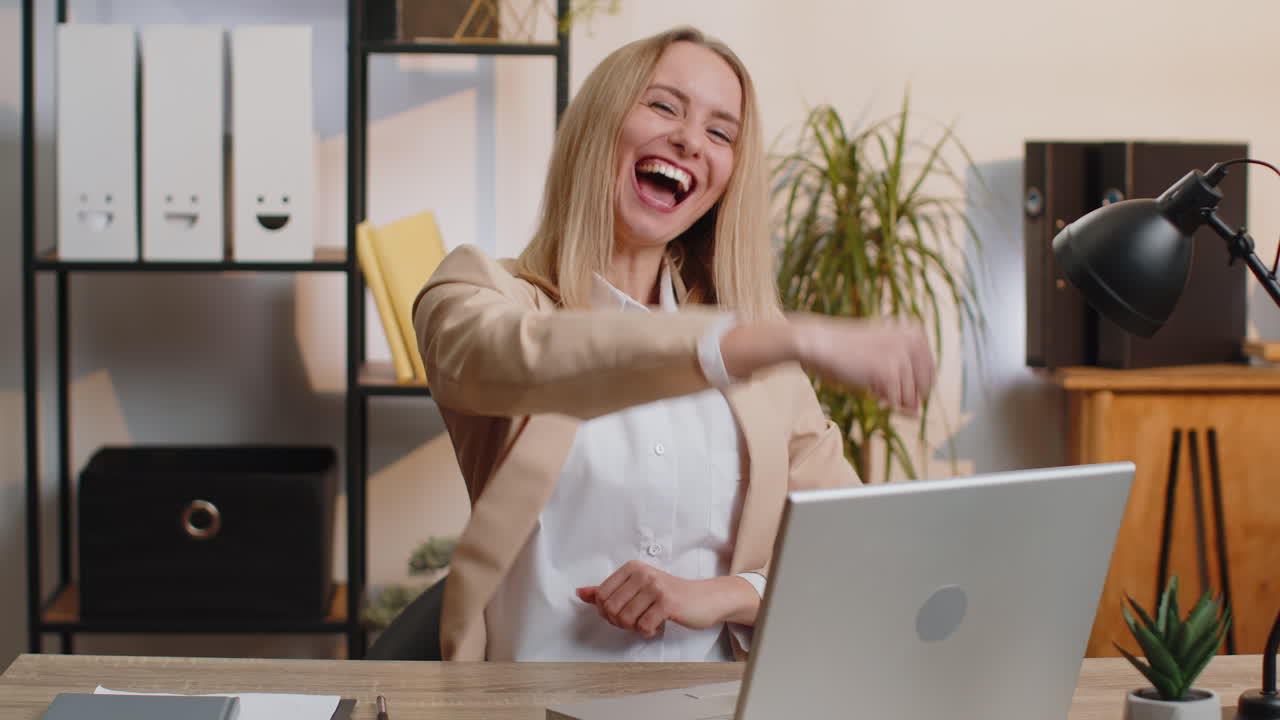 Happy amazed businesswoman shocked by sudden victory game winning lottery goal achievemen good news