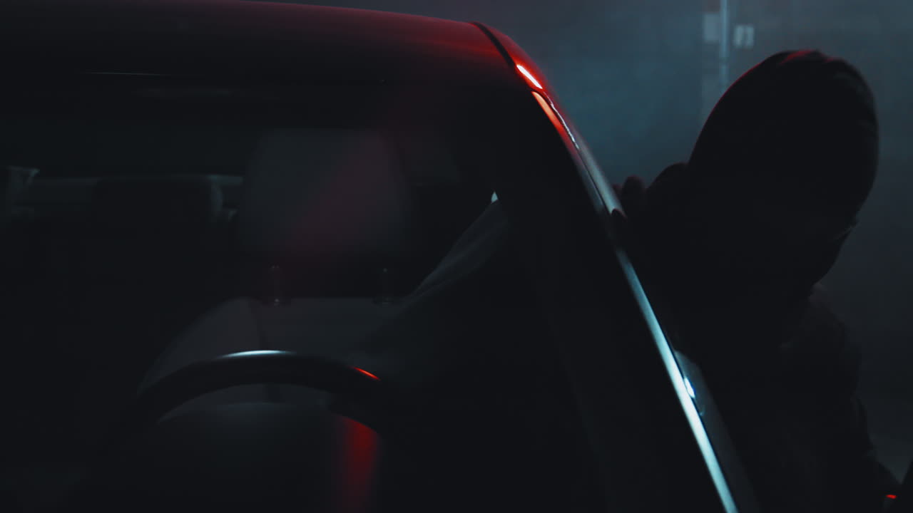 Female Burglar Breaking into Car