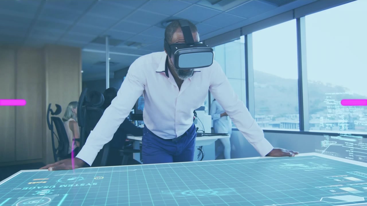 Animation of text covid 19 conspiracy and pink scanner over man in vr headset in office