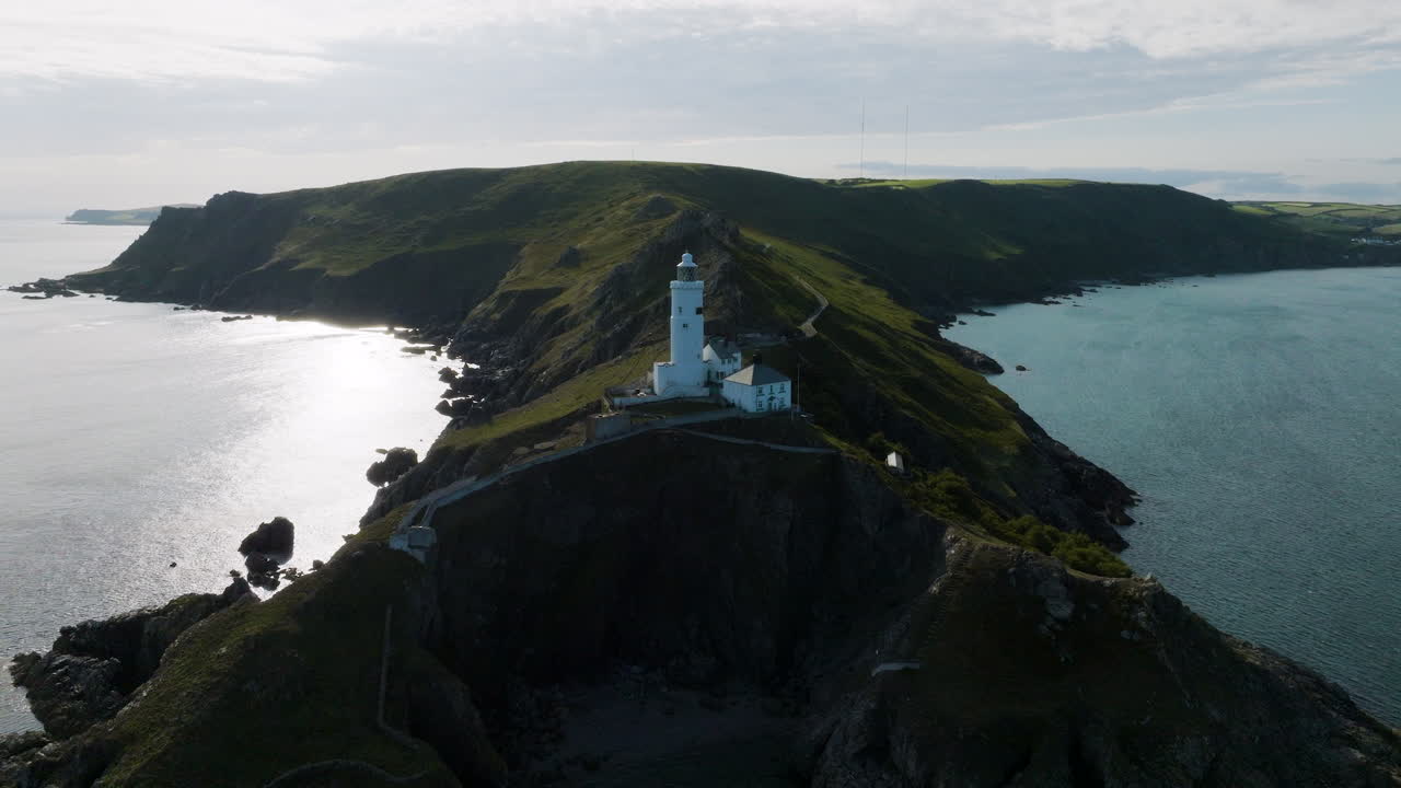 Aerial View of a Lighthouse on a Coastal Headland