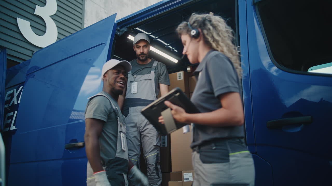 Delivery Team Loading/Unloading Packages from a Cargo Van at a Warehouse