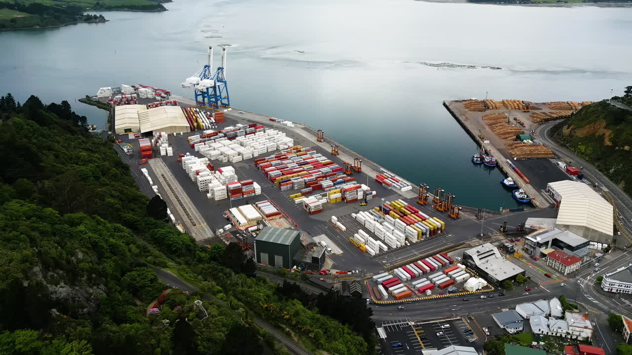 Aerial view of busy Port Chalmers container shipping port in Dunedin New Zealand