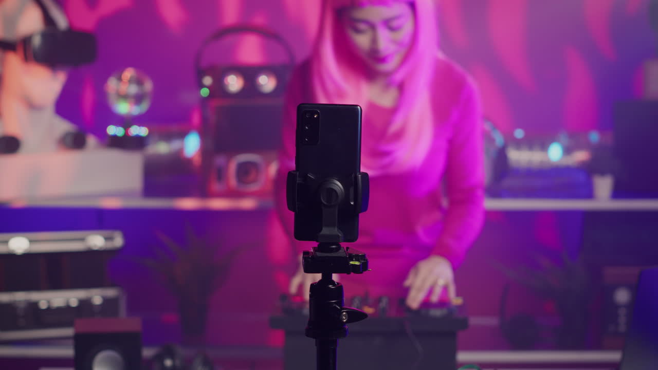 Woman with pink wig streaming DJ set