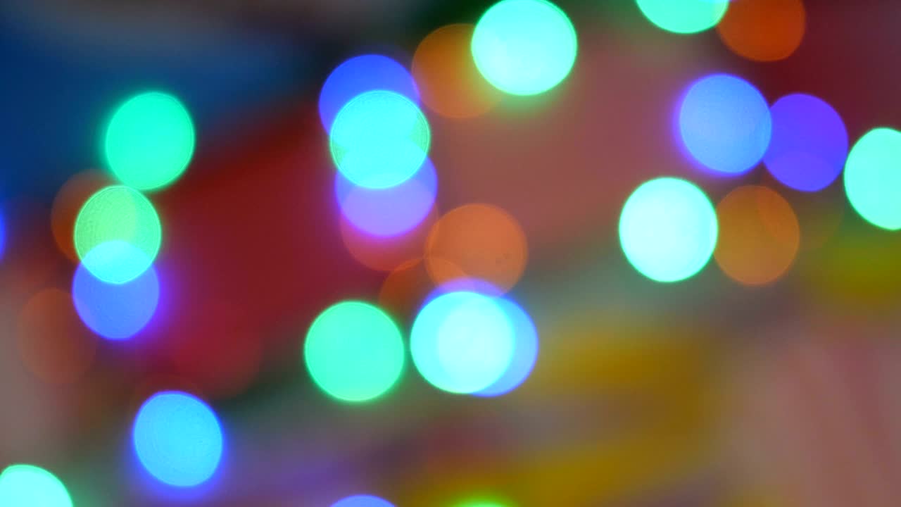 luces de colores borrosos. rojo, verde, amarillo, naranja, azul desenfocado bokeh brillante fondo festivo.
