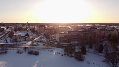 tornio city and municipality at sunset during winter in lapland, finland. aerial wide shot