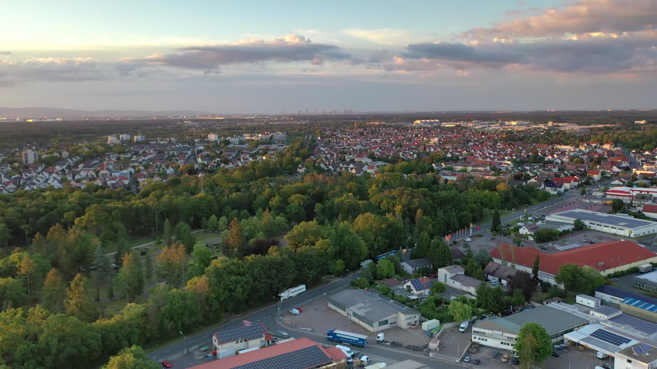 Overflight time lapse drone movie of the city Moerfelden - Walldorf with Frankfurt skyline on horizon