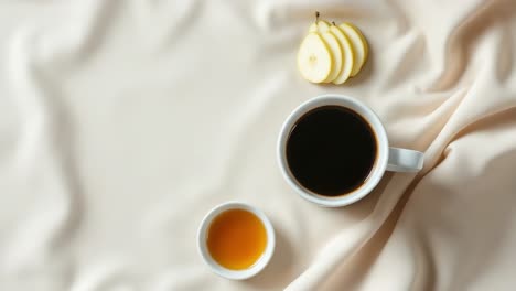 creating a cozy breakfast in bed scene with rich coffee, drizzled honey, and fresh sliced pear, inviting relaxation and comfort