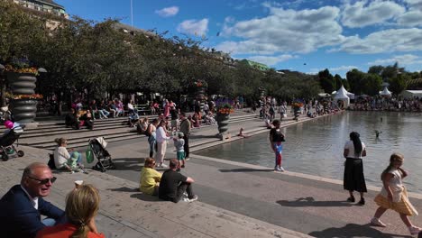 crowded city park on a sunny summer day