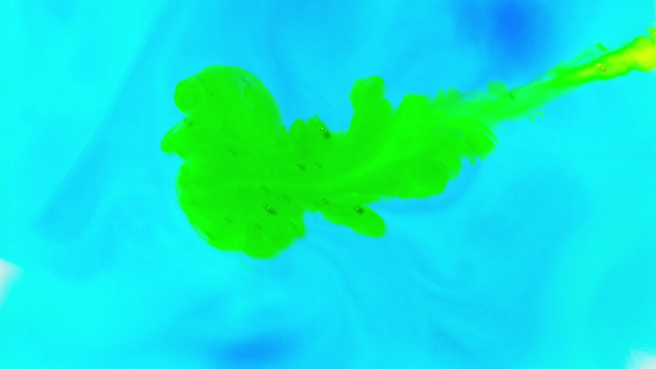 Blue And Green Paint Or Dye Dropped Into Water Against White Background To Create Swirling Colourful Smoke Background 2