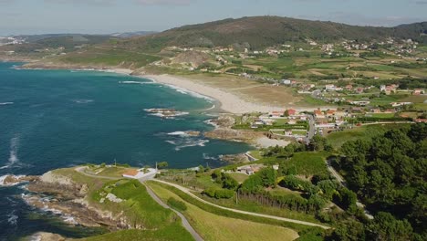 aerial view of beach and coastline on a sunny summer day in arteixo, spain.