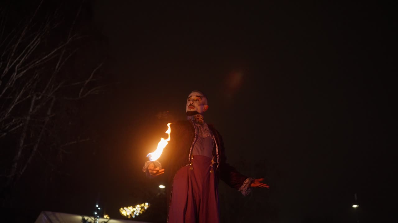 Mesmerizing fire performance at outdoor festival in slow-motion night shot
