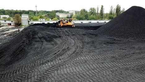 excavator in coal quarry. large heavy dump truck for working on coal mine