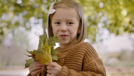 happy girl with autumnal leafs