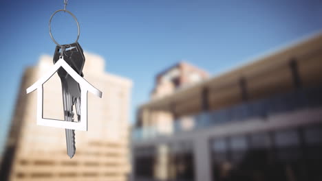 animation of silver house key and jey fob over cityscape