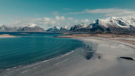 scenic yttersand beach in lofoten, norway in winter - aerial drone shot