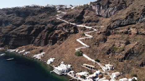 flying towards the port of thirasia, santorini, greece