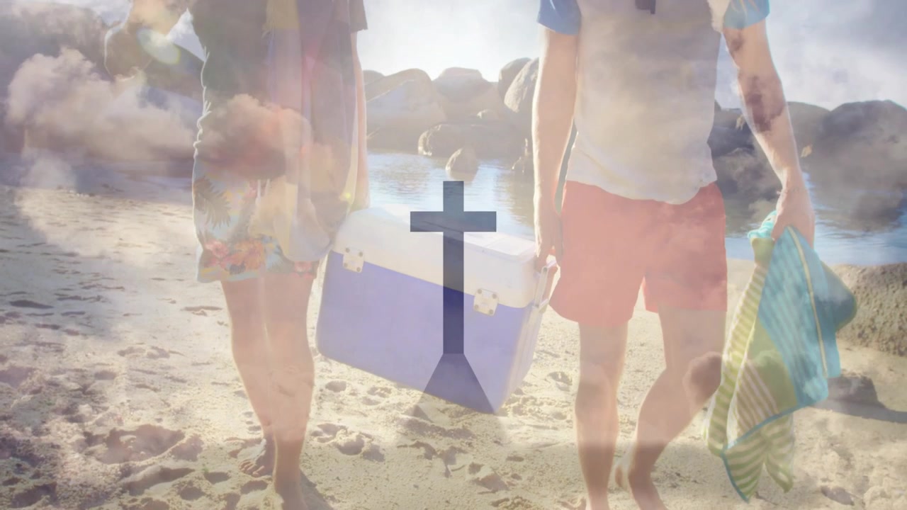 Two men hauling cooler walking shore sunflare causing cloud cross overlay fading men for leisure