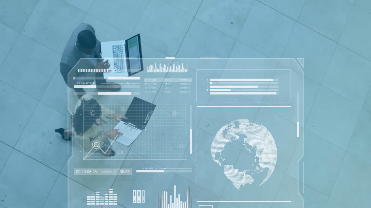 Business professionals working on laptops and documents, data analysis animation over them