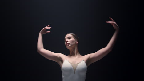 sensual ballerina rehearsing ballet steps. ballet dancer dancing indoors.