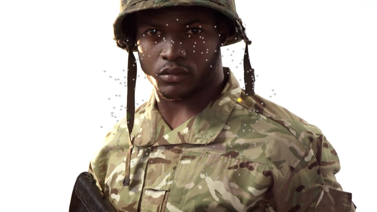 Animation von Flecken über einem afroamerikanischen Soldaten.