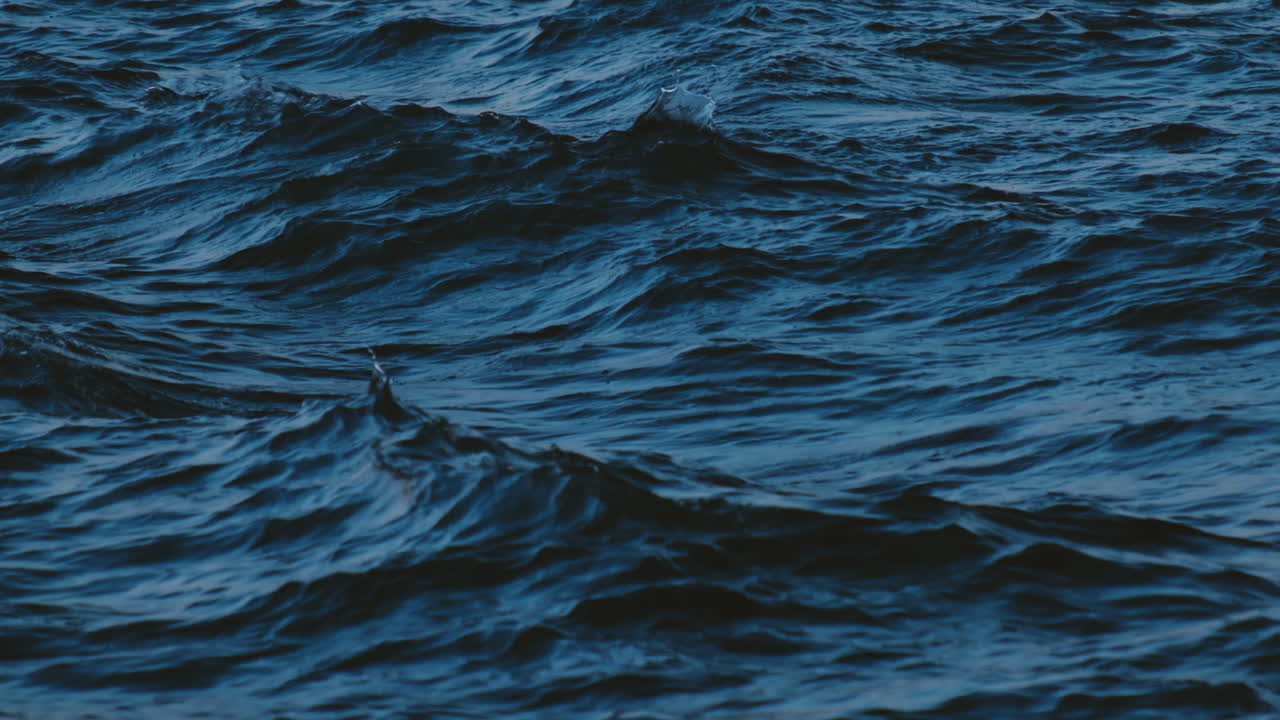 Slow motion of blue sea water surface