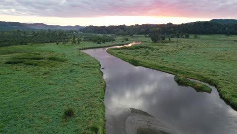 sunrise over a winding river