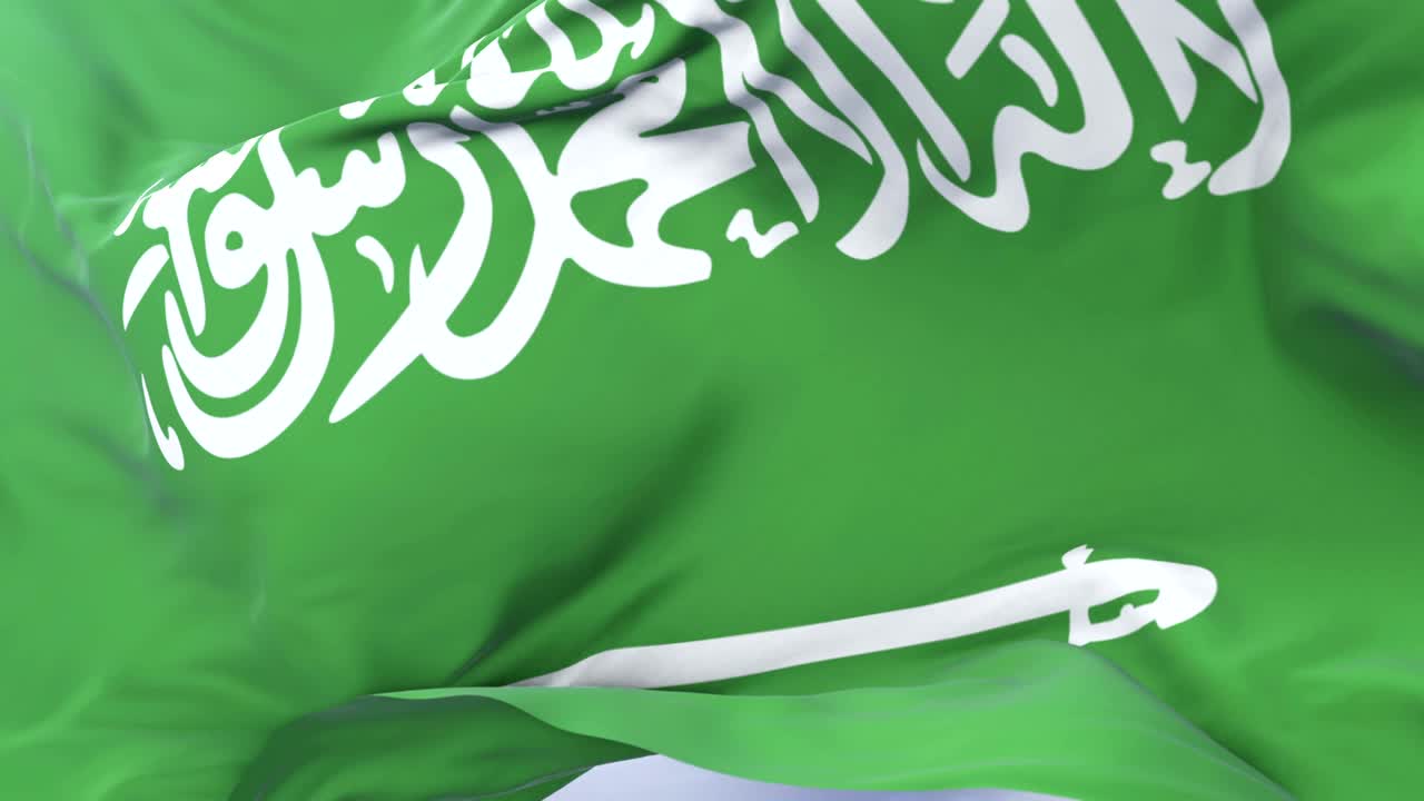 Saudi Arabia flag waving at wind in slow with blue sky, loop