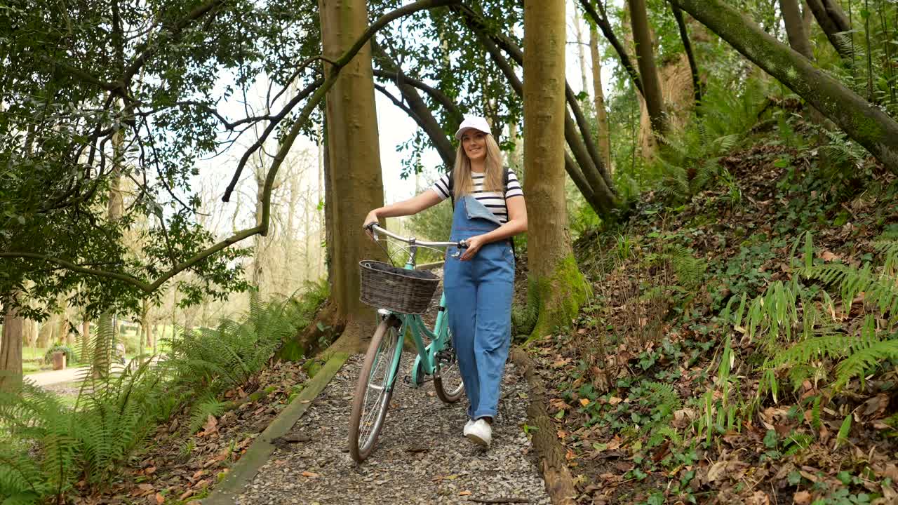 Woman with Bicycle in Forest