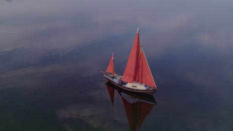 wide shot of sailboat anchored at lauwersmeer friesland, aerial