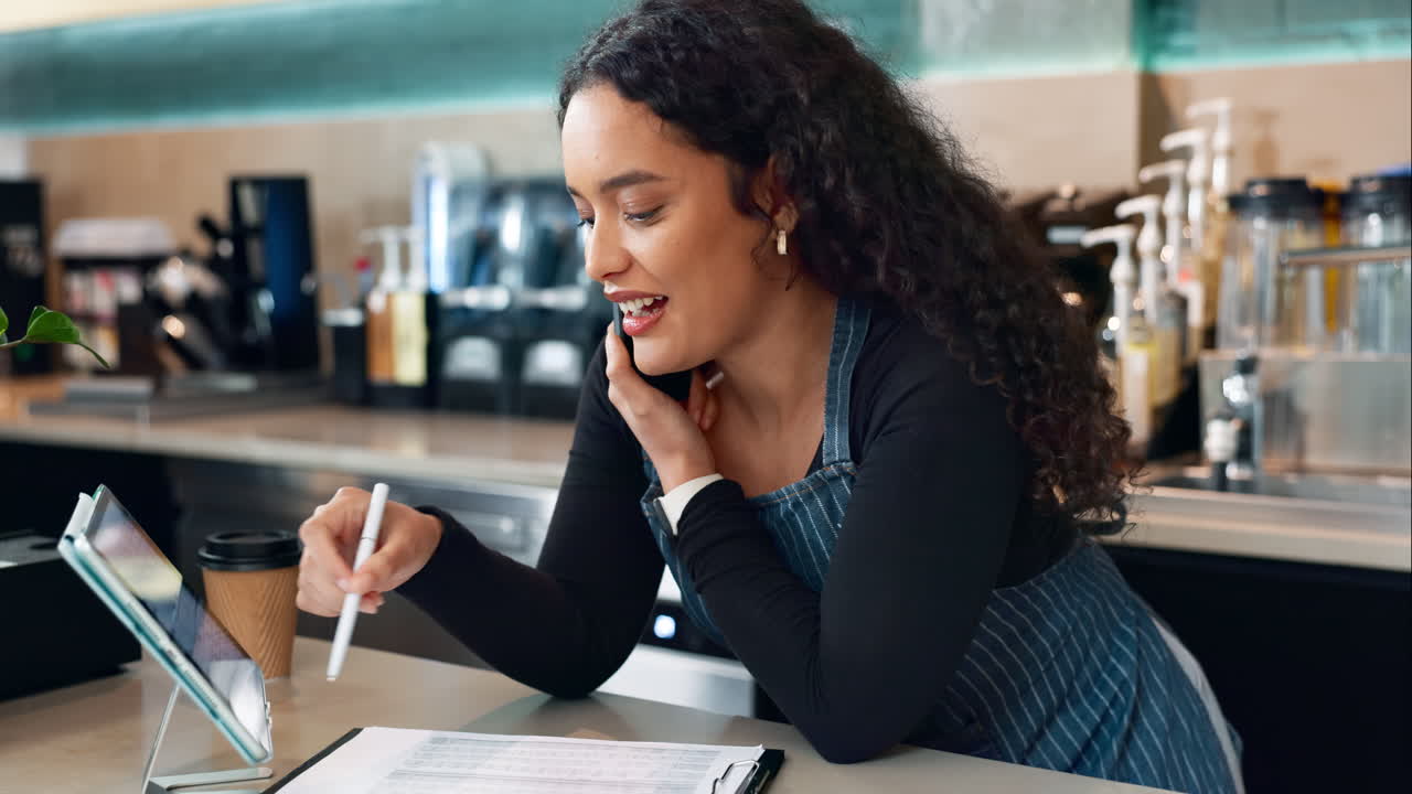 Cafe, phone call of barista and woman on tablet