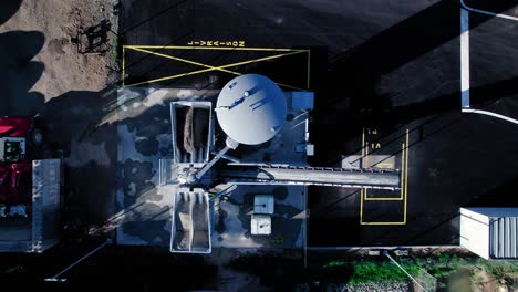 Top-down-rising-shot-of-a-self-service-professional-concrete-plant-in-Nimes